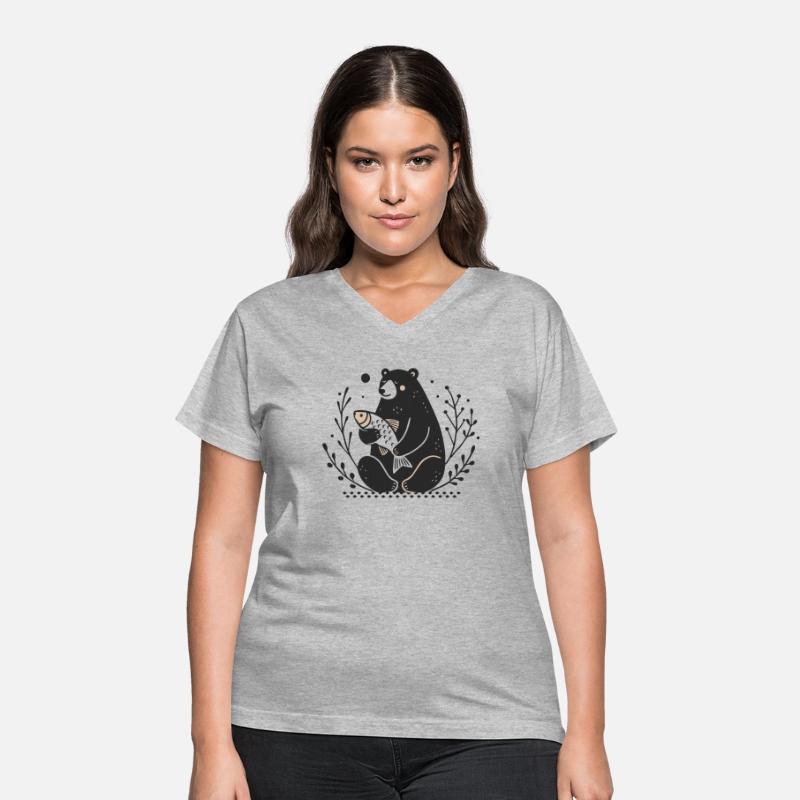 A sitting bear holding a fish