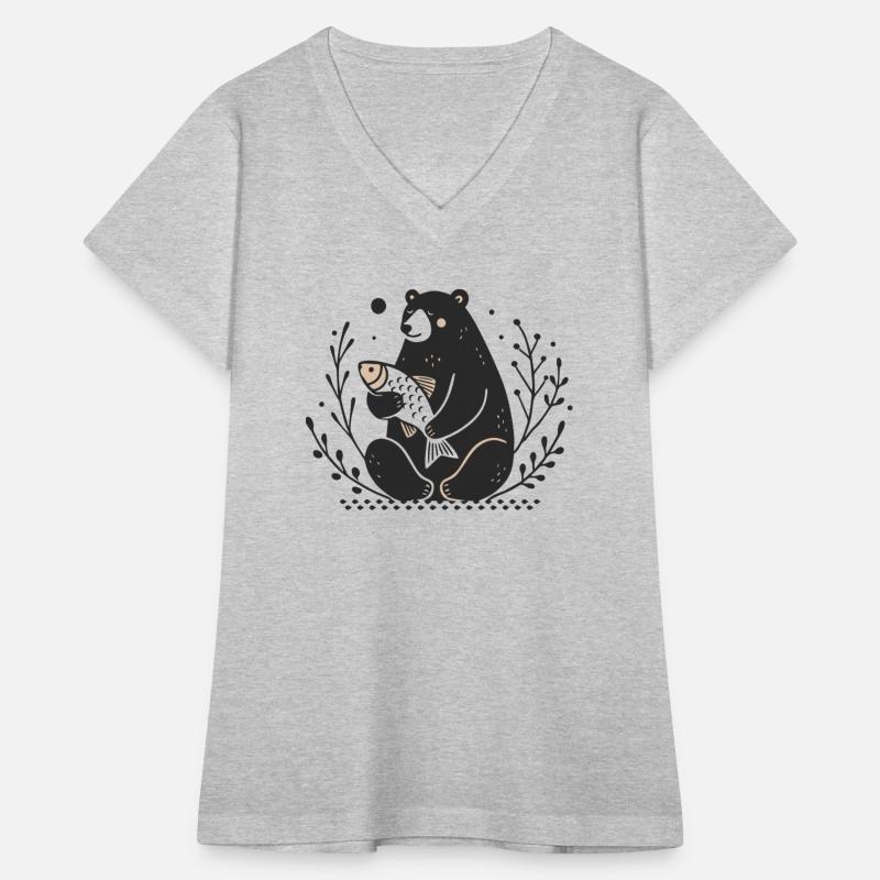 A sitting bear holding a fish